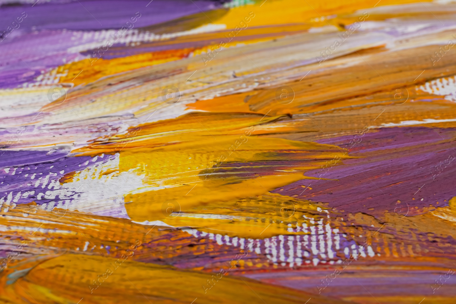 Photo of Beautiful strokes of colorful oil paints on white canvas as background, closeup