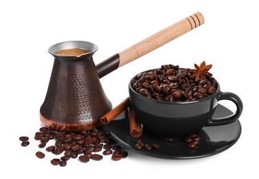 Metal turkish coffee pot with hot drink, beans and spices on white background