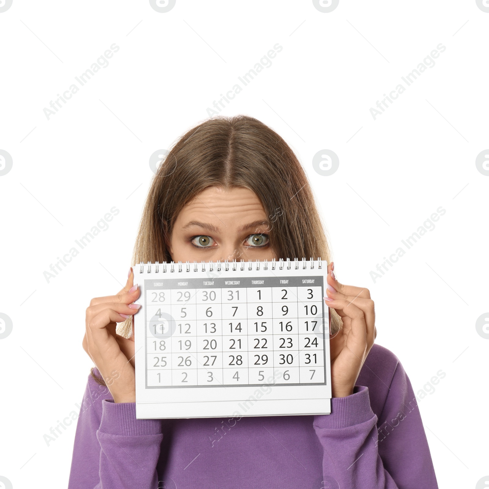 Photo of Young woman holding calendar with marked menstrual cycle days on white background