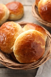 Photo of Freshly baked soda water scones on wooden table, closeup