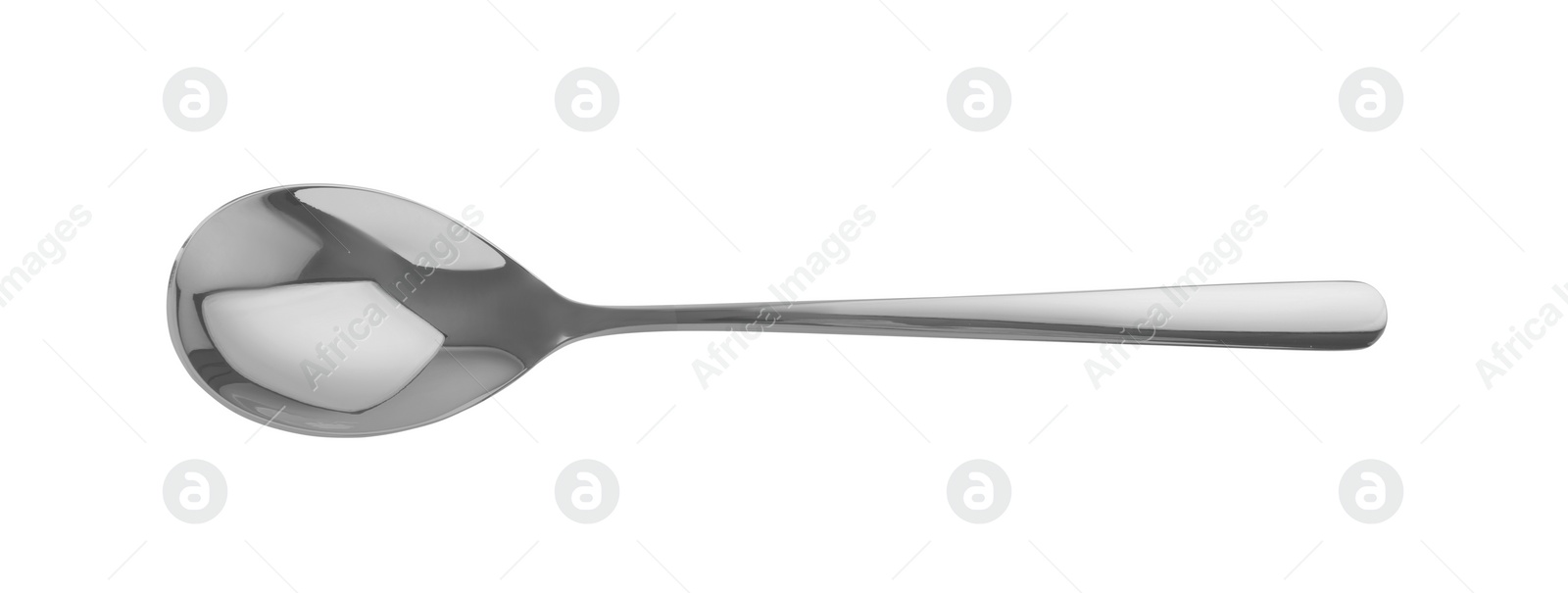 Photo of One shiny silver spoon isolated on white, top view