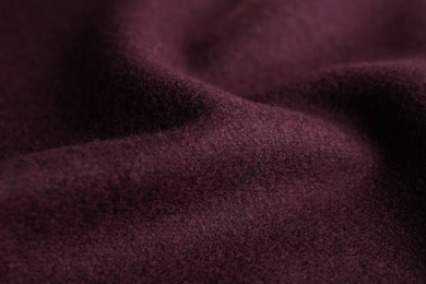 Photo of Texture of beautiful dark red fabric as background, closeup