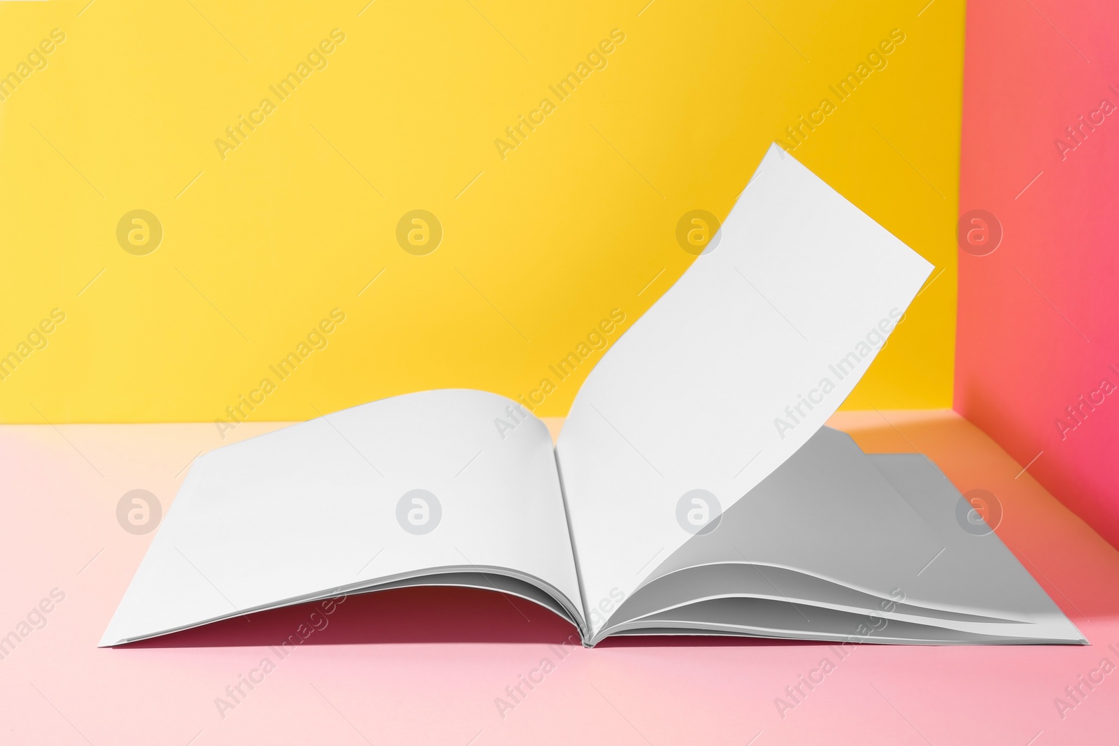 Photo of Empty book pages on color background. Mockup for design