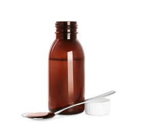 Bottle of cough syrup and spoon on white background