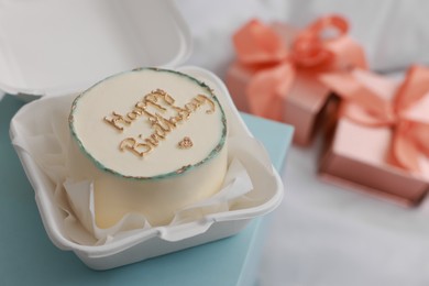 Photo of Delicious decorated Birthday cake on light blue surface, closeup. Space for text