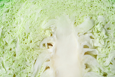 Photo of Fresh cut savoy cabbage as background, closeup