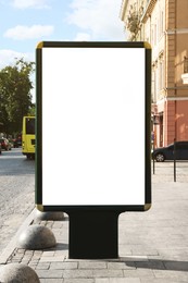 Blank citylight poster on street in city. Space for design