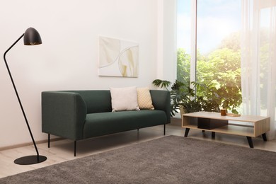 Photo of Living room interior with soft grey carpet and modern furniture