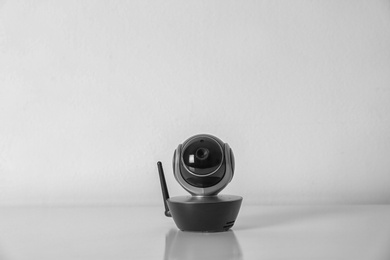 Modern CCTV security camera on white background