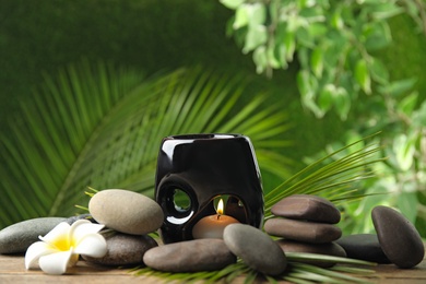 Photo of Composition with stones on table against blurred background. Zen concept