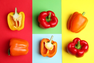 Photo of Flat lay composition with ripe bell peppers on color background