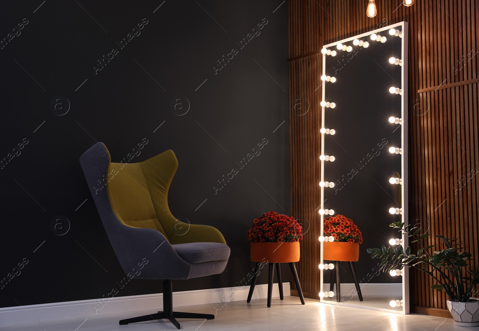 Photo of Large mirror with light bulbs in stylish room interior