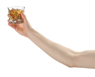 Photo of Man holding glass of whiskey with ice cubes on white background, closeup