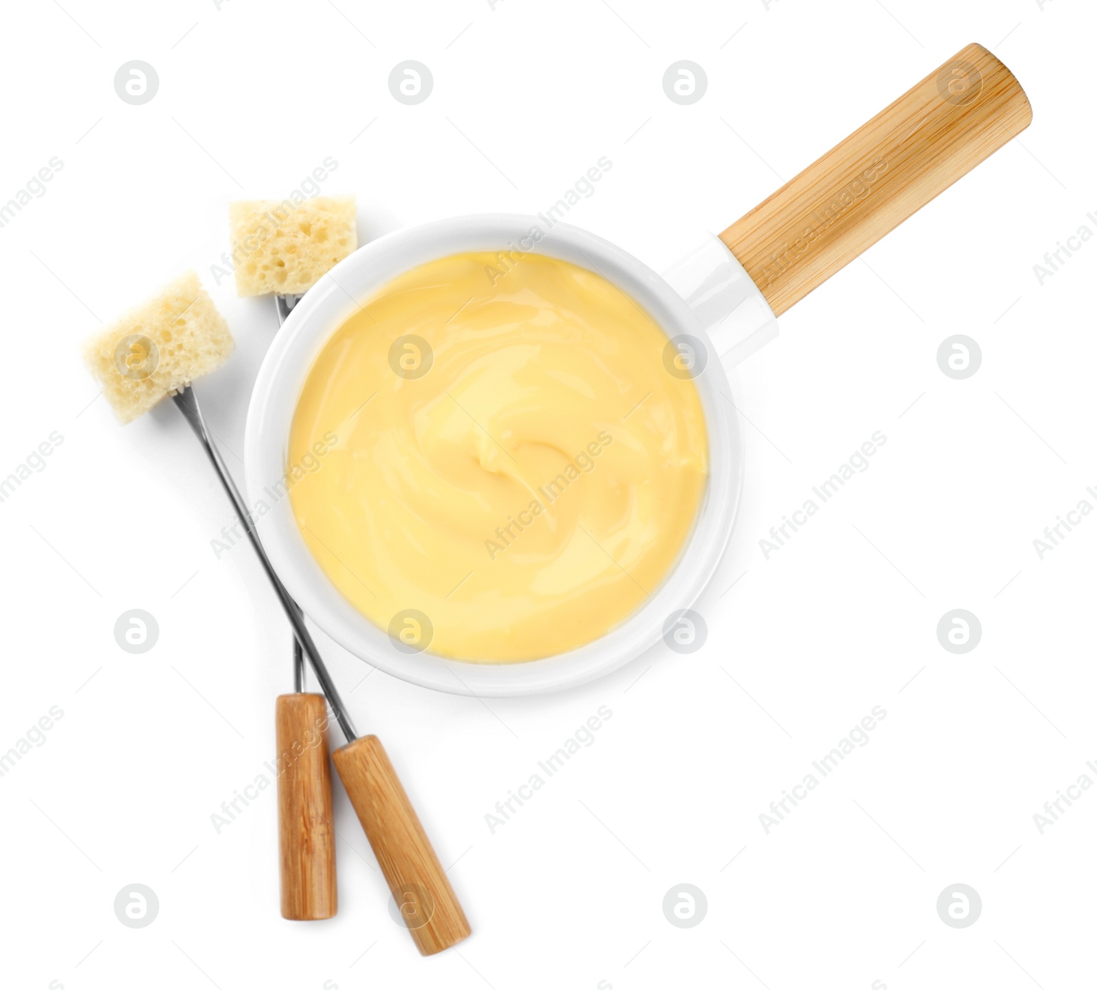 Photo of Pot of tasty cheese fondue and forks isolated on white, top view