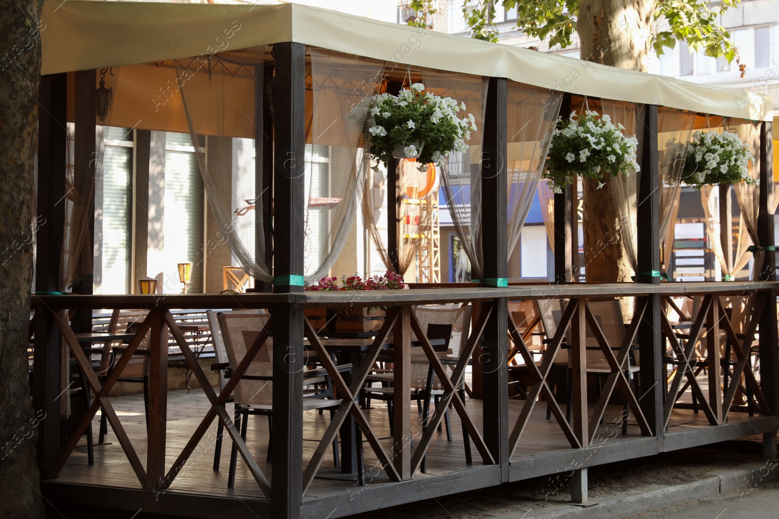 Photo of Beautiful view of modern cafe with outdoor terrace