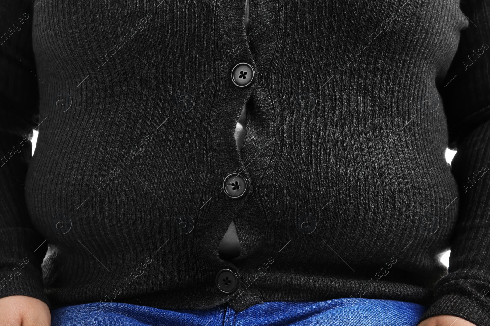 Photo of Overweight person in tight clothes, closeup