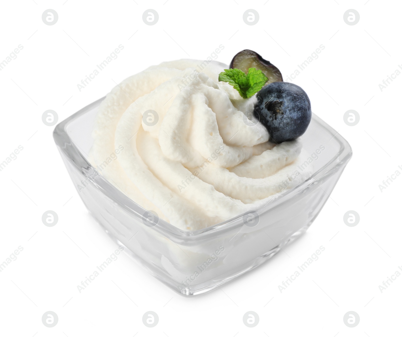 Photo of Delicious fresh whipped cream with blueberries and mint isolated on white