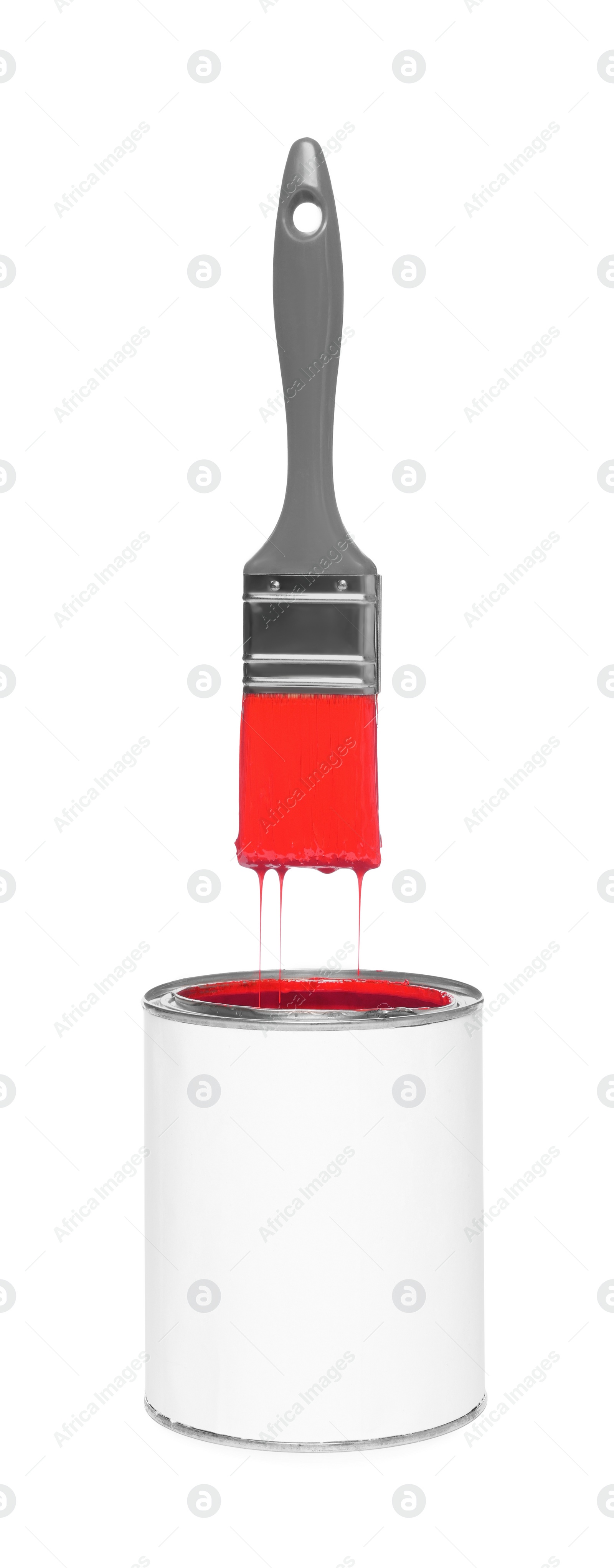 Image of Brush with red paint in air over can on white background