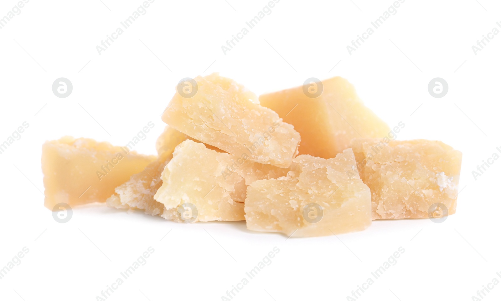 Photo of Pieces of delicious parmesan cheese on white background