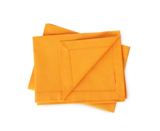 Photo of New clean orange cloth napkins isolated on white, top view
