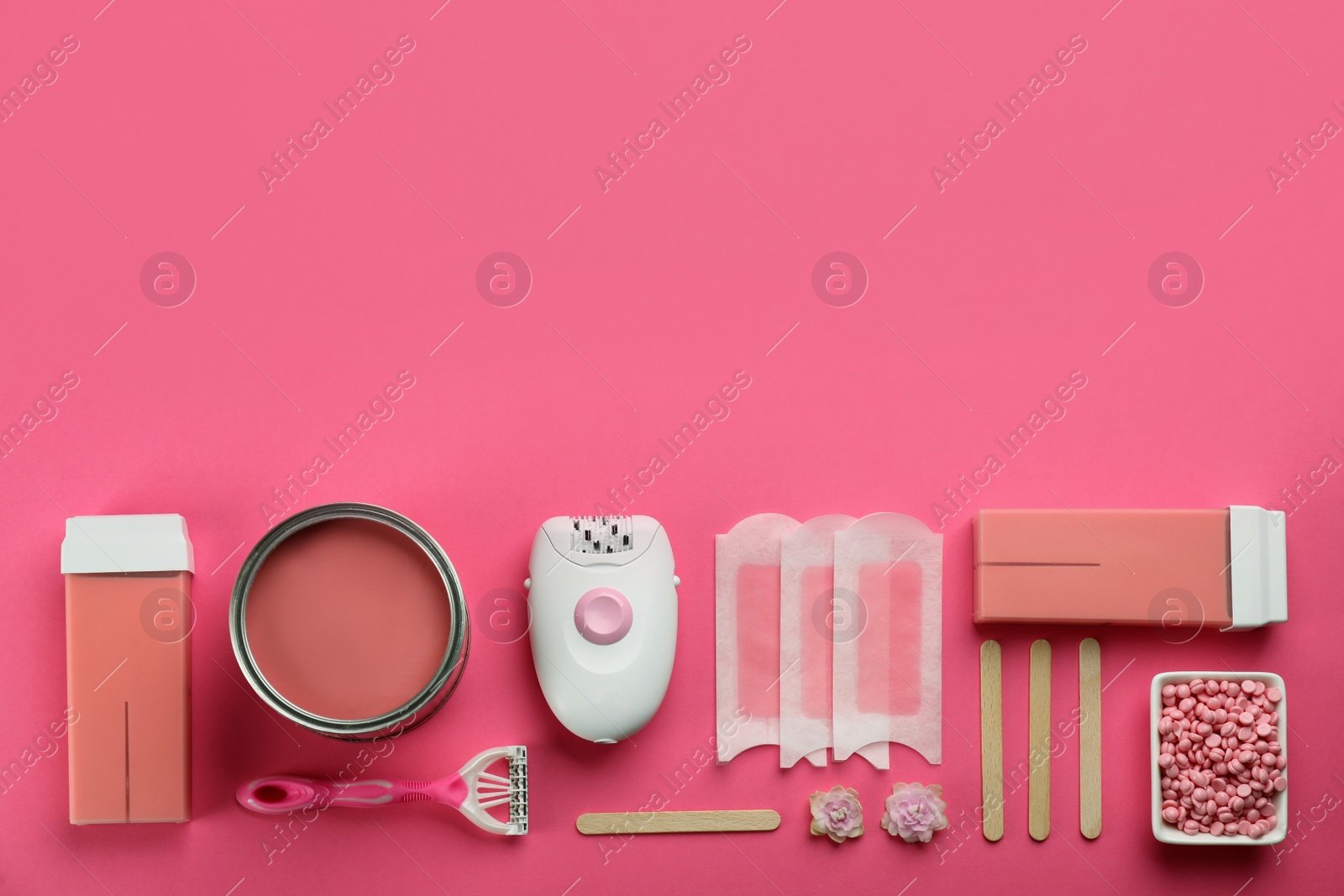 Photo of Set of epilation products on pink background, flat lay. Space for text