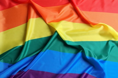 Photo of Bright rainbow gay flag as background. LGBT community