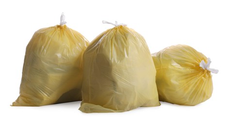 Trash bags full of garbage on white background