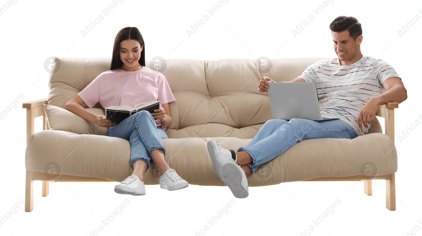 Photo of Happy couple resting on comfortable sofa against white background