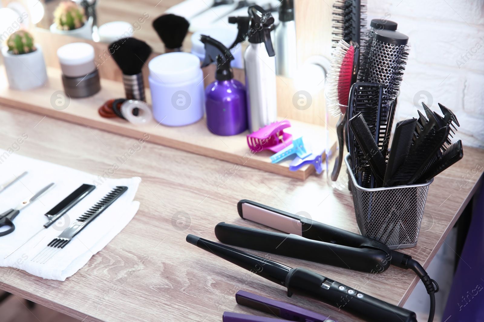 Photo of Hairdresser tools on table in salon