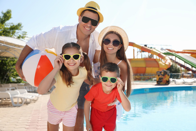 Photo of Happy family at water park. Summer vacation