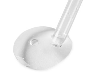 Photo of Glass pipette and transparent liquid isolated on white