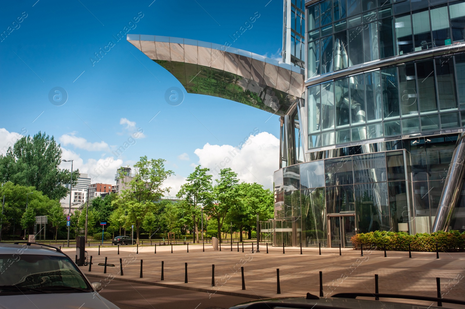 Photo of Beautiful building with many windows and impressive architectural canopy in city