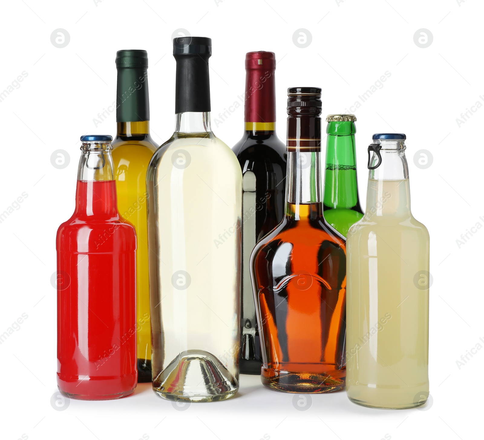 Photo of Bottles with different alcoholic drinks on white background