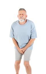 Photo of Mature man with urological problems suffering from pain on white background