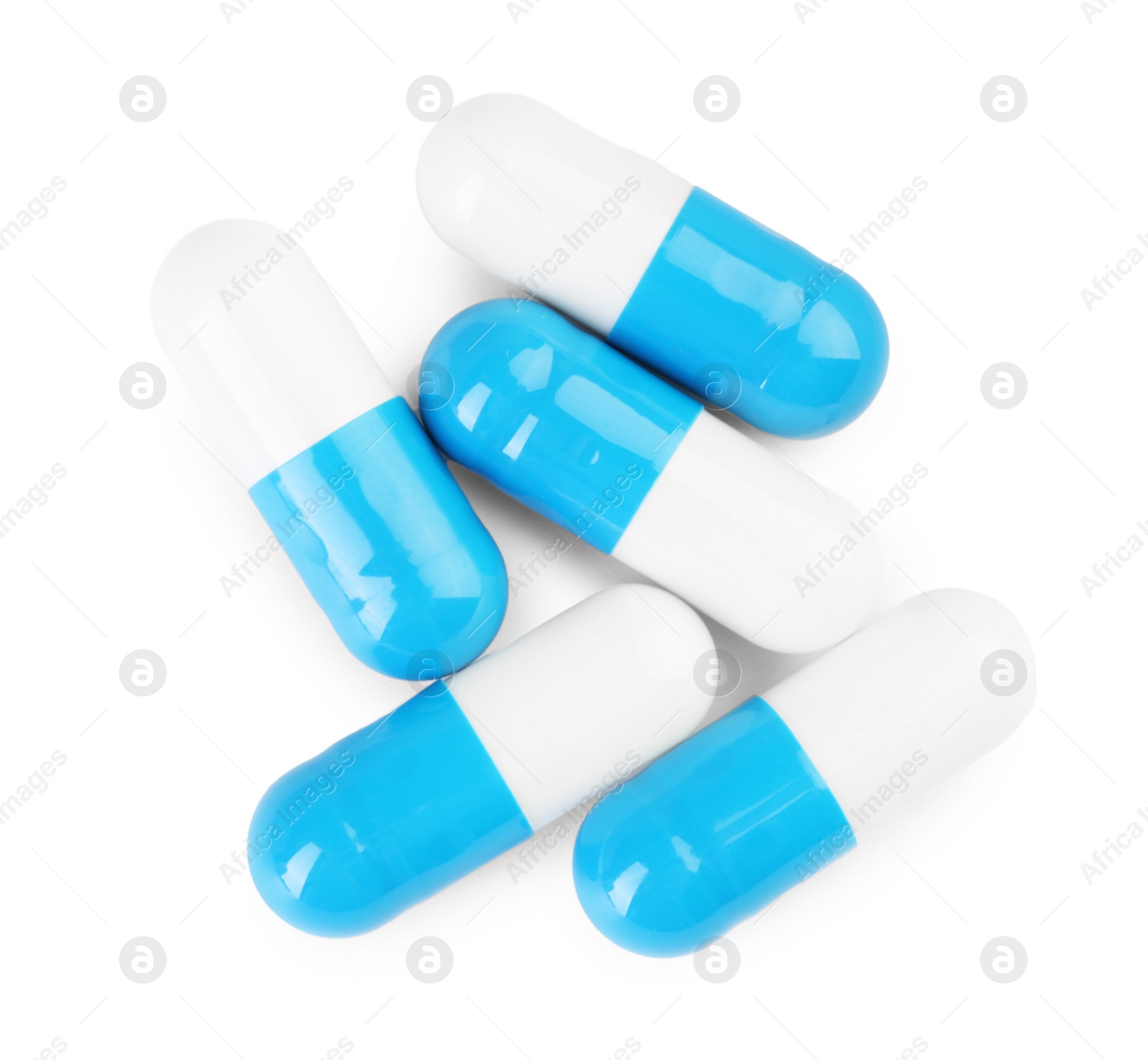 Photo of Antibiotic pills isolated on white, top view