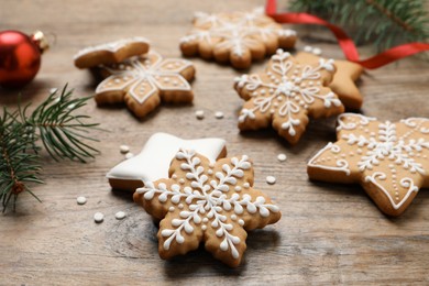 Tasty Christmas cookies on wooden table, closeup