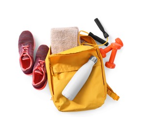 Photo of Backpack with sports equipment on white background, top view