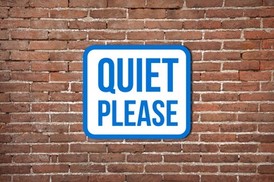 Image of Quiet Please sign on red brick wall