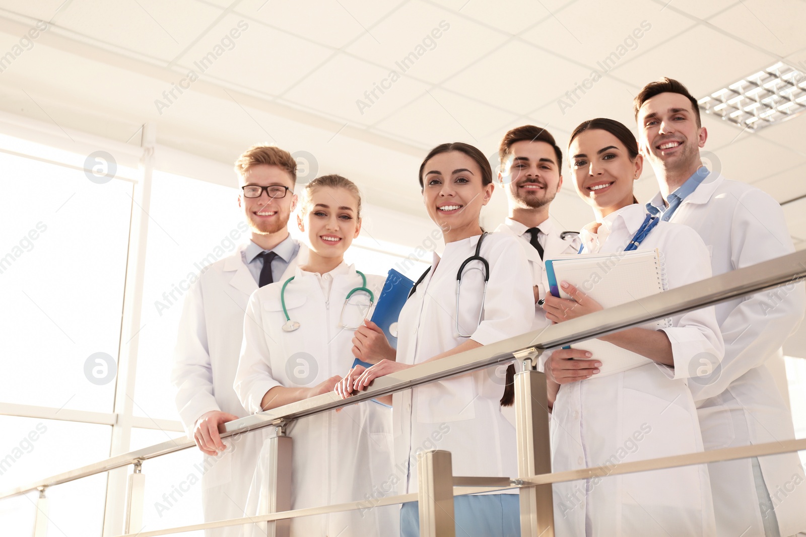 Photo of Group of medical doctors indoors. Unity concept