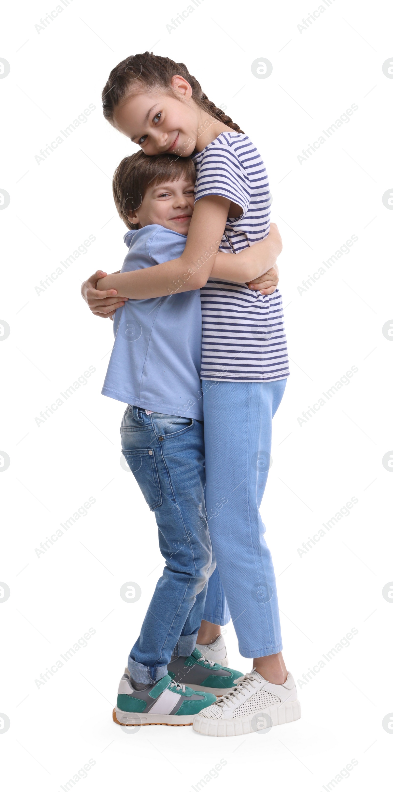 Photo of Happy brother and sister hugging on white background