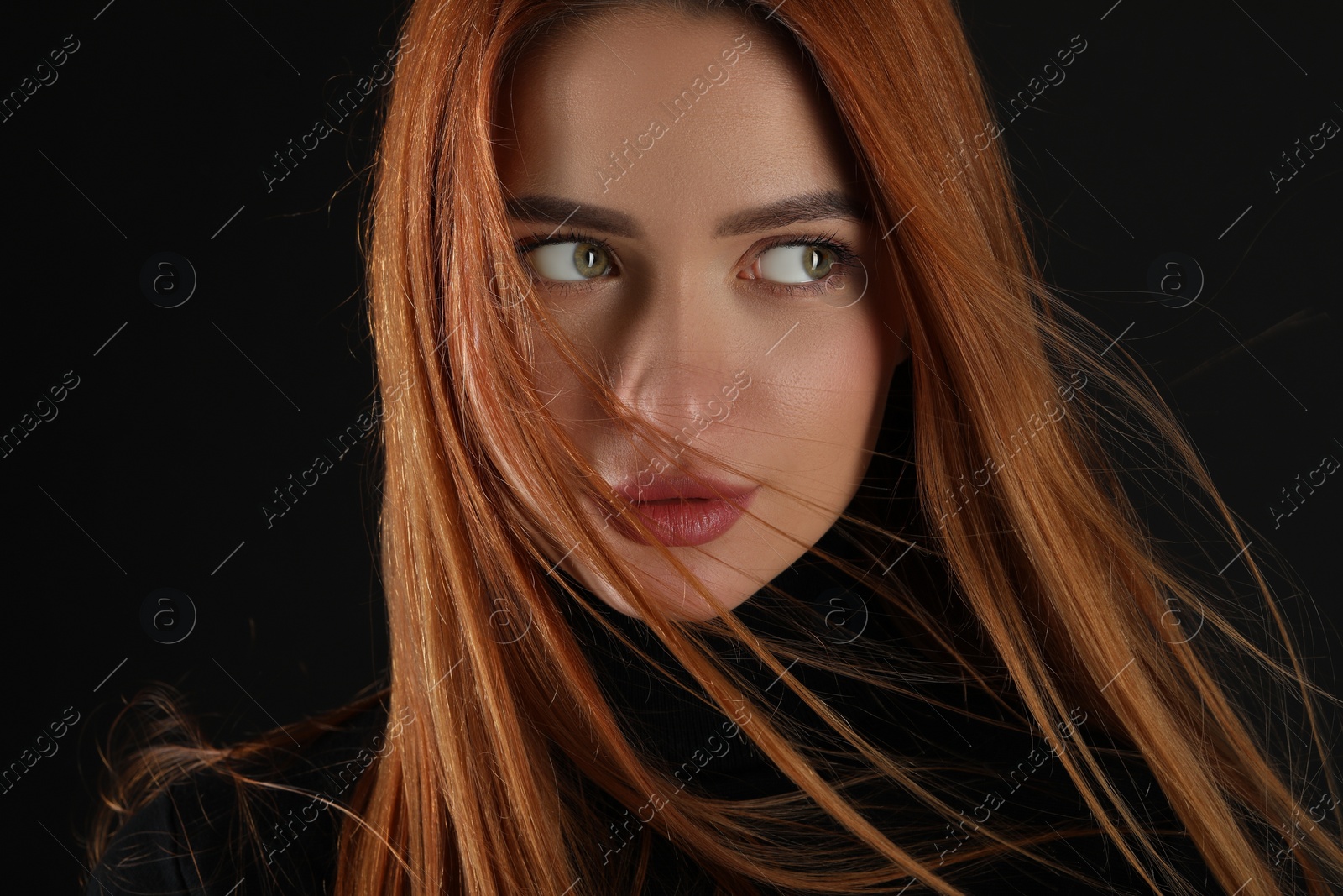 Photo of Evil eye. Young woman with scary eyes on black background