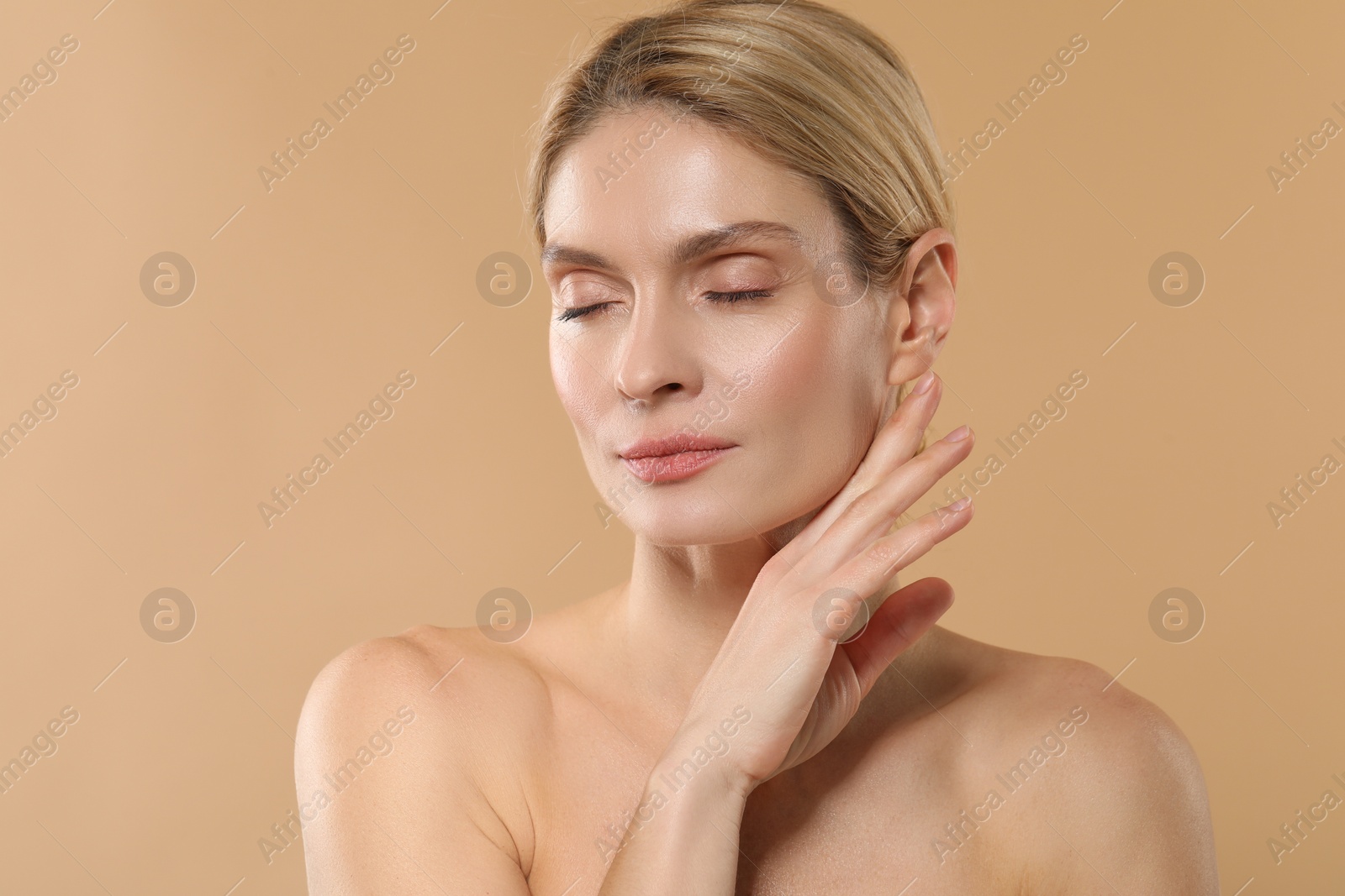 Photo of Beautiful woman with healthy skin on beige background