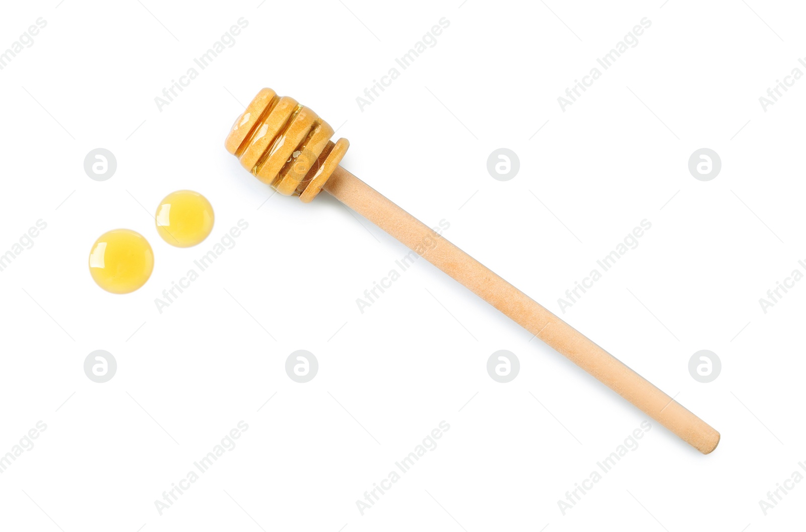 Photo of Wooden dipper and fresh honey on white background, top view