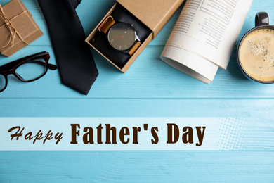 Image of Flat lay composition with male accessories and phrase HAPPY FATHER'S DAY on light blue wooden table