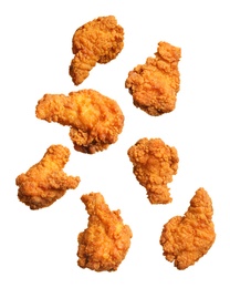 Image of Fresh fried chicken falling on white background