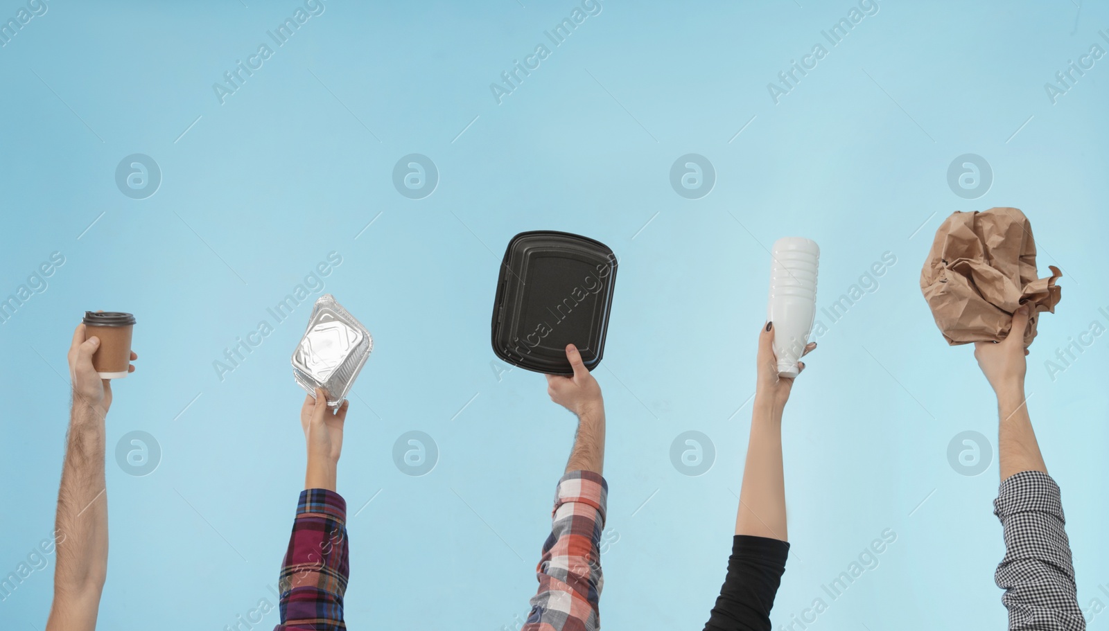 Photo of People holding different garbage on color background. Waste recycling concept