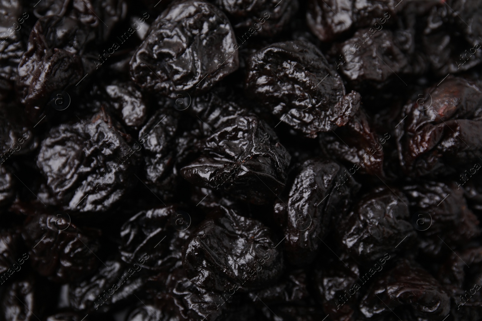 Photo of Sweet dried prunes as background, closeup view