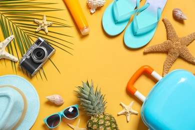 Flat lay composition with beach accessories on color background. Space for text