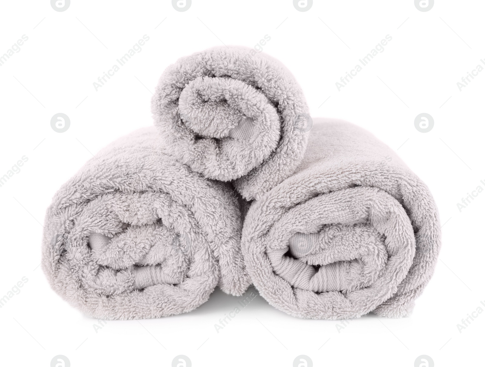 Photo of Rolled soft terry towels isolated on white