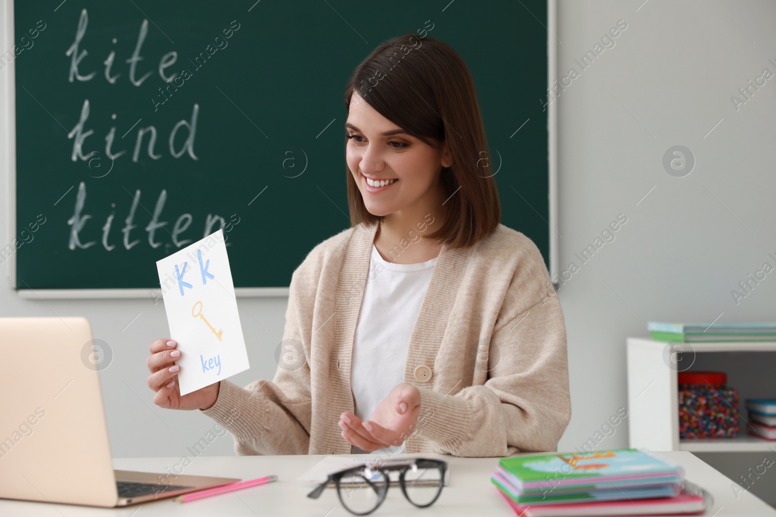 Photo of Happy English teacher giving online lesson. Early childhood education